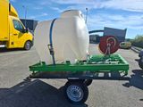 a trailer with a large container on the back of it