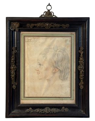 an antique portrait of a woman in profile in a black frame