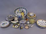 many different types of plates and bowls on the table
