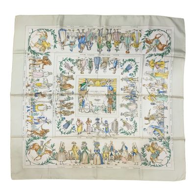 une photo d'un foulard carré sur lequel sont représentées des personnes
