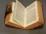 an open book that is sitting on a table