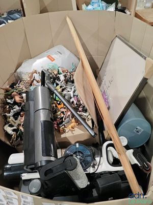 a cardboard box filled with assorted items in it