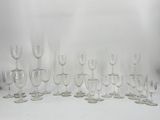 a lot of wine glasses sitting on a table