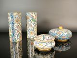 three vases that are sitting on a table