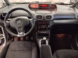 a picture of a car dashboard with a clock on it
