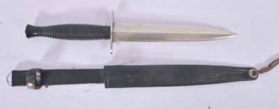 two different types of knives on a white surface