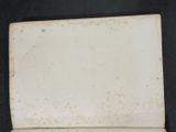 a small piece of paper with a picture of a cat on it