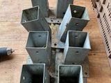 a wooden table with a bunch of metal pieces on top of it