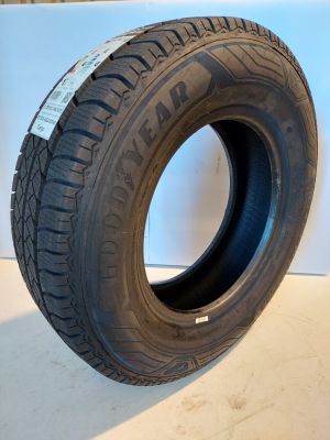 a close up of a tire on a white surface with a white background