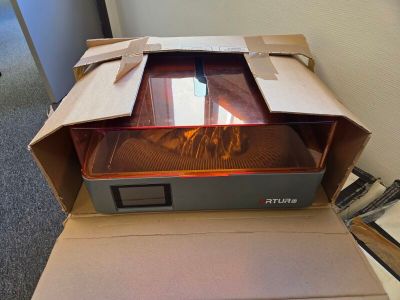 a box with a printer inside of it on a table