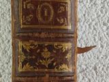 an old book that is sitting on a table