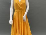 an image of a mannequin wearing a yellow dress on a mannequin mannequin