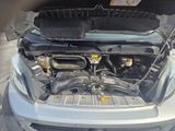 a car that has its hood open with the engine in it