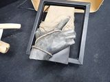a picture of a glove in a box on the floor