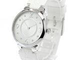 the watch is white and has a silver face