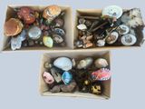 two boxes filled with assorted items on top of each other