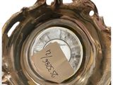 a silver plate with a note in the middle of it