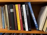 a book shelf with many books on top of it