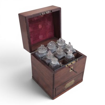 a wooden box with a bunch of bottles inside of it