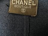 a label on a chanel coat that says chanel boutique