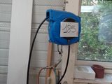 a blue blow dryer sitting next to a window in a room