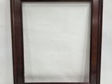 an old picture frame with a white background and a brown wood frame