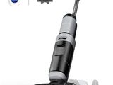 an image of a black and white vacuum cleaner with a cleaning brush