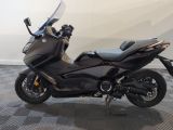 a picture of a motorcycle parked on a checkered floor