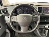 the interior of a car with a steering wheel and dashboard controls