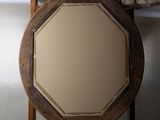 a man standing next to a mirror in a room