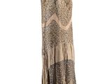 a dress on a mannequin stand with a white background