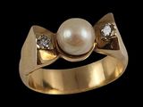 an image of a gold ring with a pearl and diamonds