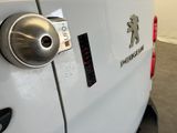 a close up of a car ' s tail light with a bear emblem on it
