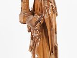 a wooden statue of a woman holding a bird and a bird cage