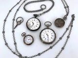 a white plate with a bunch of different clocks on it