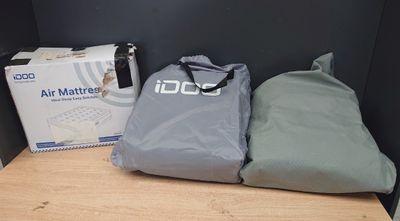 two bags that are sitting on a shelf next to each other
