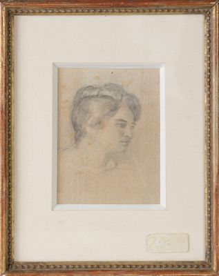 un dessin représentant la tête d'une femme dans un cadre doré