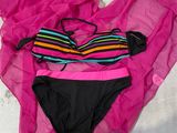 a bikini and panties laying on the floor next to each other