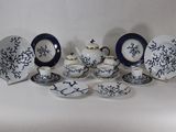 many plates and cups that are sitting on a table