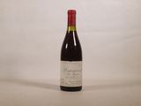 a bottle of wine that is sitting on a table