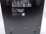 the back of a laptop with a battery on top of it