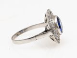 an oval blue sapphire and diamond ring set in white gold