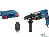 a drill with a hammer and other tools on a white background