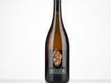 a close up of a bottle of wine on a table