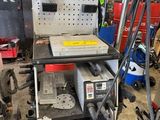a machine that is sitting on a table in a garage