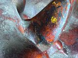 a close up of a statue of a bird on it ' s back