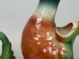 two vases sitting next to each other on a table