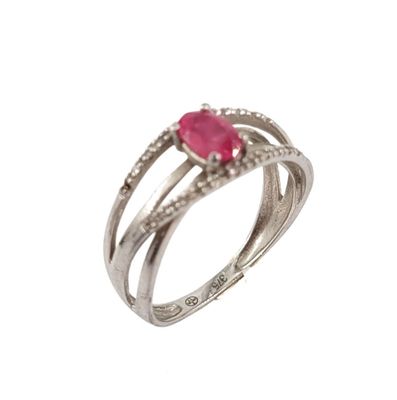 a close up of a ring with a ruby stone on it