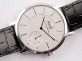 a close up of a wrist watch with a white dial