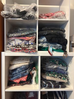 a closet with many different types of clothing in it